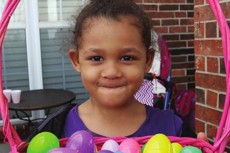 A-TISKET, a-tasket, Marley Bailey, 4, fills her Easter basket with more than two dozen eggs during the community hunt.