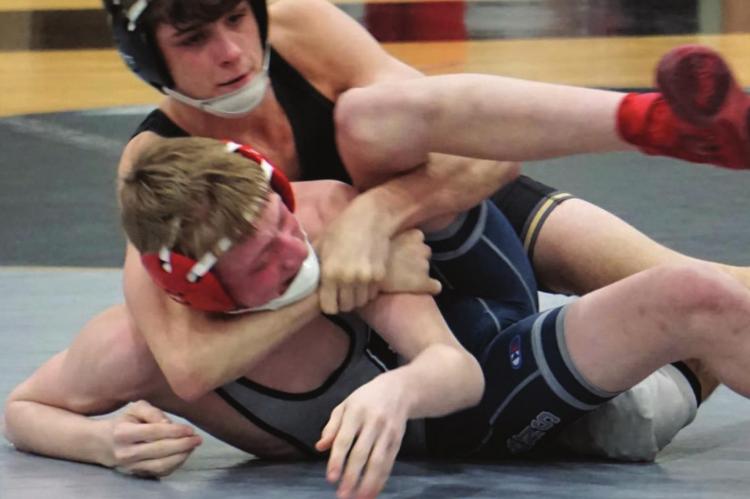 FRESHMAN MICAH DANNER, seen here winning a postseason match, represents the Tigers this week at 120 in the Class 2 state tournament.