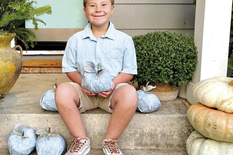 GRAYSON GROSSO, 9, shows off a teal pumpkin and the new message for candy-filled holidays. His mother, Sara Grosso, is an advocate for the project. (Submitted by Sara Grosso)