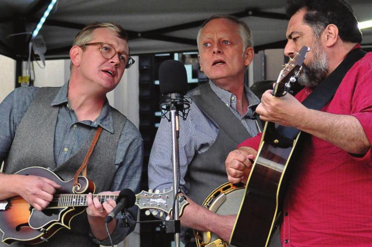 HARMONIZING, from left, are Brian McCarty; Excelsior Springs native Todd Davis; and Greg Blake. They sing tight as the Greg Blake Hometown Band performs at the Hall of Waters during Gatsby Day in Excelsior Springs. SHAWN RONEY | Staff