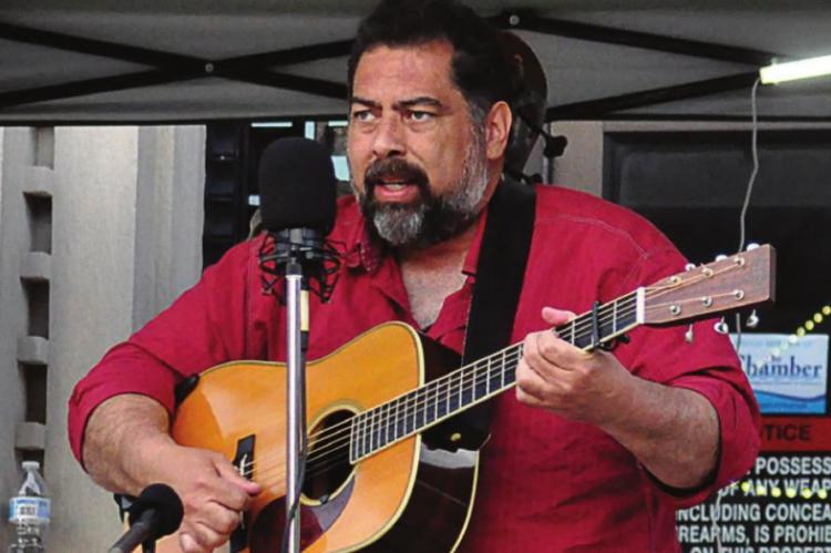 DURING 2021’s Gatsby Day in Excelsior Springs, Greg Blake plays guitar. SHAWN RONEY | Staff