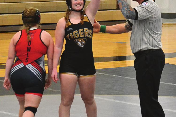 EXCELSIOR SPRINGS senior Sierra Stodden gets her hand raised in victory in her first match after returning from an injury. DUSTIN DANNER | Staff