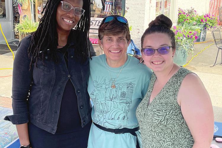 TRIVEECE PENELTON, Laurie Brown and Becca Pruett attend Waterfest and poll residents on flood issues in downtown Excelsior Springs. BRIAN RICE | Staff
