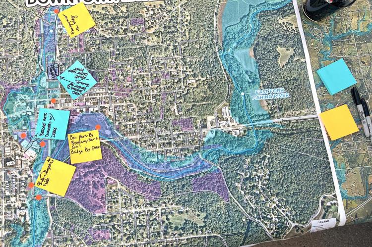 THIS MAP OF DOWNTOWN Excelsior Springs highlights the flood plain along the Fishing River, with notes provided by residents explaining to Vireo staff the areas of impact during flooding. The information will help Vireo develop a master plan for improvements. BRIAN RICE | Staff