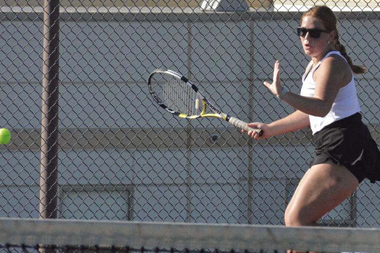 OLIVIA DEERE looks to hit a forehand shot during Excelsior Springs’ varsity girls tennis dual with Kearney. SHAWN RONEY | Staff