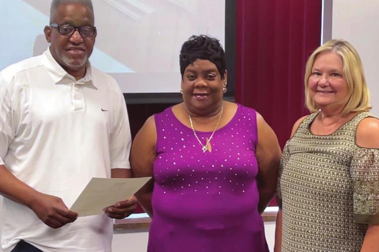 MAIN STREET Baptist Church Pastor James L. Wesley and his wife, Janet, receive the Juneteenth proclamation from Excelsior Springs Mayor Sharon Powell. BRIAN RICE | Staff