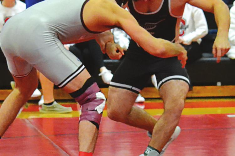 JONAH COWDEN of Excelsior Springs works to get the inside position on his opponent en route to a third-place finish Jan. 29 at the Odessa Invitational. DUSTIN DANNER | Staff