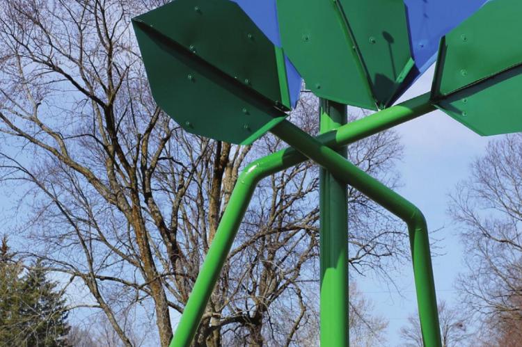 SCRAP METAL and a fertile imagination grow into this flower sculpture with bees. J.C. VENTIMIGLIA | Staff