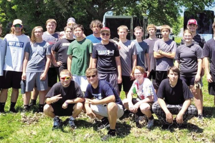 ESHS FOOTBALL teammates gather July 13 for a day of community service, helping 18 families and businesses during the annual Tiger Service Day.