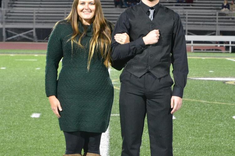 Senior king candidate Caleb Hatfield is escorted by his mother Becca Hatfield. (Photo by Jae Juarez)