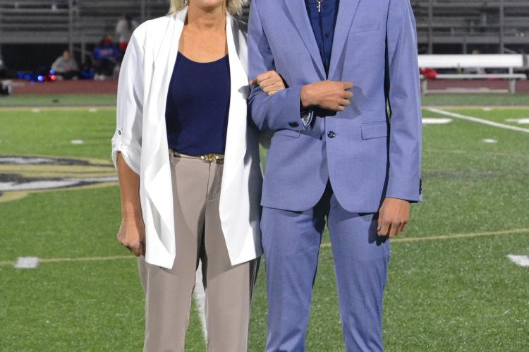 Senior king candidate Jalen Soria shares a smile with mother Brandee Soria. (Photo by Jae Juarez)