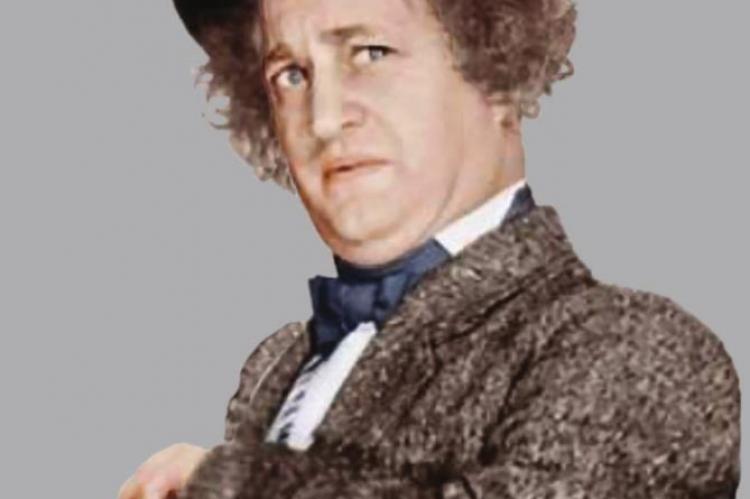 COMEDIAN Larry Fine of The Three Stooges played a cigar box instrument.