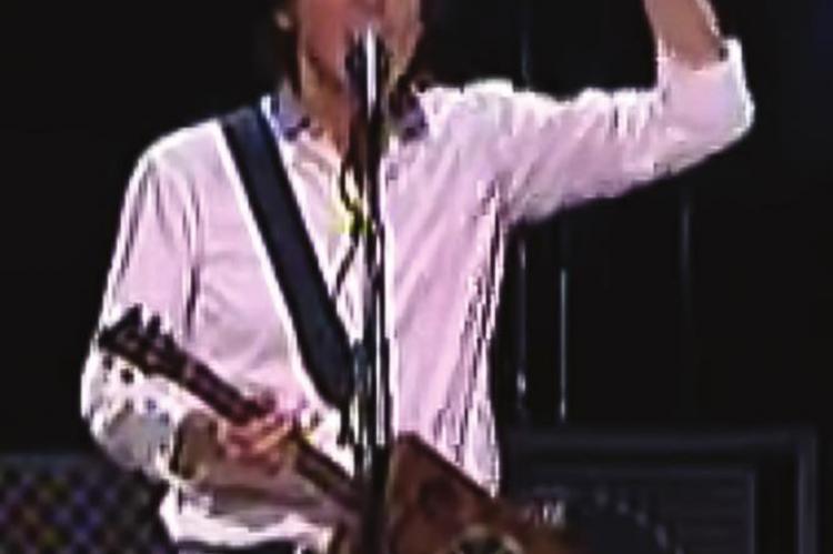 MUSICIAN Paul McCartney wins a Grammy Award playing this cigar box guitar.