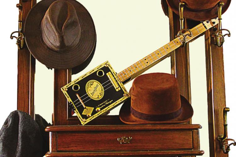 J.C. VENTIMIGLIA | Staff THE MUSIC of a cigar box guitar is as welcome now as in days long past by those who appreciate music.