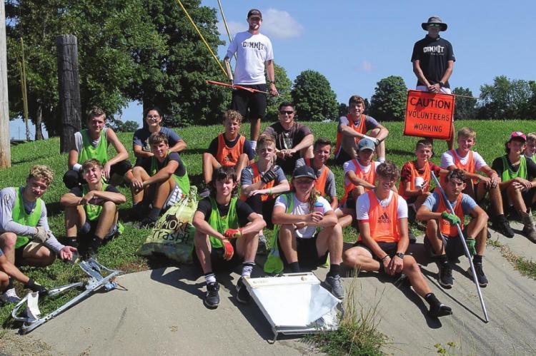 ABOUT TWO DOZEN Excelsior Springs High School soccer players and support staff personnel turn out to remove street litter in the vicinity of Jesse James Road. J.C. VENTIMIGLIA | Staff