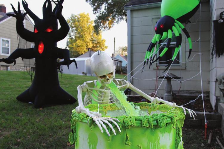 AT 707 AND 705 E. Lexington St., Richmond, this skeleton must have bellowed to a frat boy or sorority girl in life, because in death there is a constant stream of green ookiness pouring from his mouth. J.C. VENTIMIGLIA | Staff