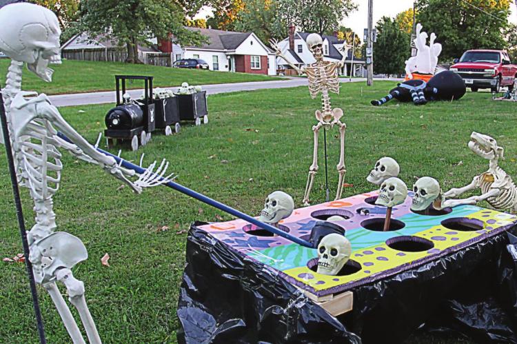 A DELIGHTFUL GAME of whack-a-skull is underway on the front lawn at the Glynn residence, 705 E. Lexington, Richmond. Their displays have attracted community members for several years. J.C. VENTIMIGLIA | Staff