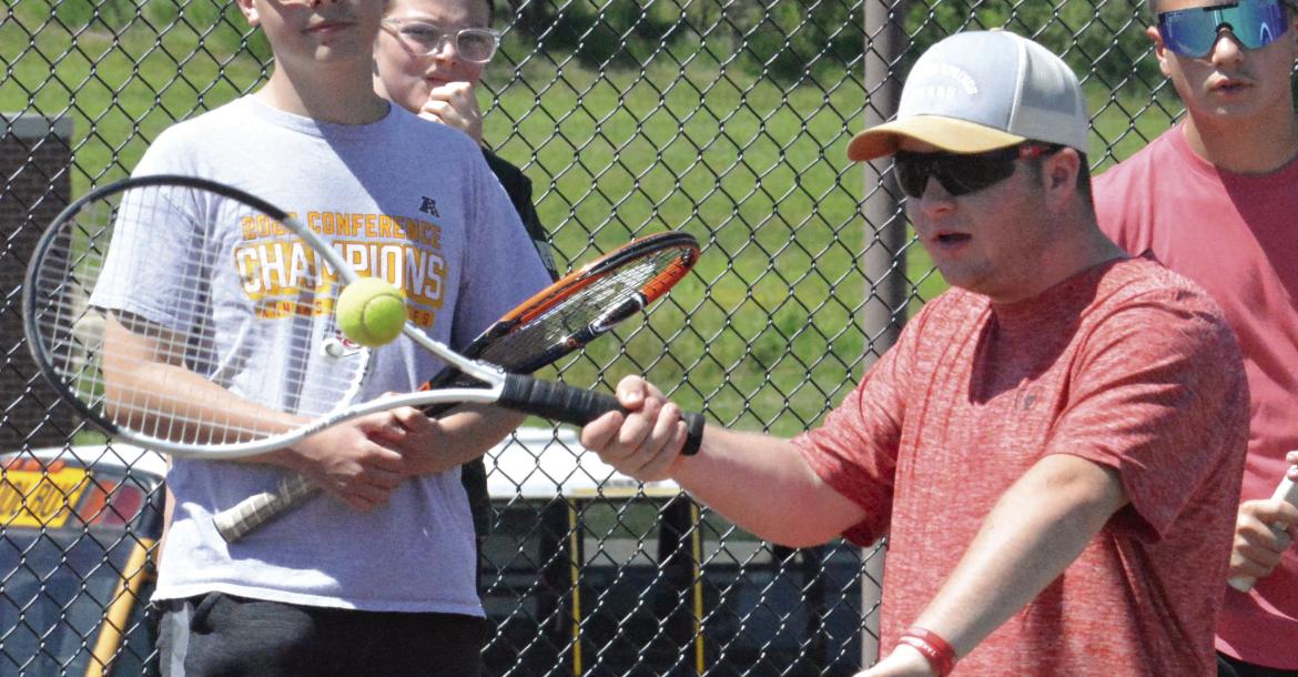 DANTIN McBEE looks to hit a forehand shot as he and other Excelsior Springs student athletes particiapte in a high school tennis camp. SHAWN RONEY | Staff