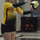 EMERIE QUALLS prepares to serve in Orrick’s season-opening match against Lone Jack. SHAWN RONEY | Staff