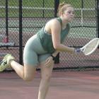 WITH THE second day of girls tennis practices concluding and a youth tennis camp session getting underway, veteran Excelsior Springs netter Laney Crowley takes a break from assisting with the camp to serve a few shots.