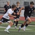 TYLER WARTNER (right) pursues the ball during Excelsior Springs’ tournament meeting with Kearney. The Tigers, who defeated their Missouri Highway 92 rivals, were scheduled to play Kearney again this week in a stand-alone game. Soccer coverage continues on page 6. SHAWN RONEY | Staff