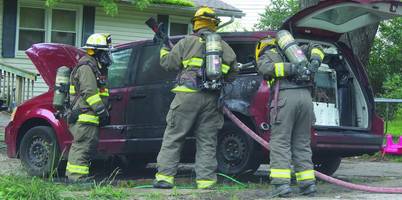 THE EXCELSIOR SPRINGS FIRE AND POLICE departments respond to a report of a vehicle fire on Cordell Street in Excelsior Springs. Officials say the fire started after a gas can ignited and spread to the vehicle. MIRANDA JAMISON | Staff