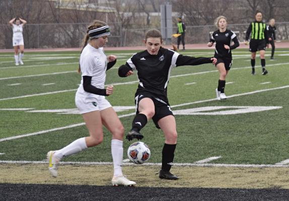 EXCELSIOR SPRINGS SOPHOMORE Shelby Stodden steps in and gains control of the ball Tuesday during the Tigers’ season opener with visiting Mid-Buchanan in varsity girls soccer. DUSTIN DANNER | Staff