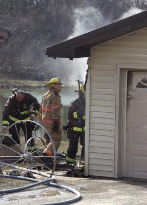 ESFD AND LFD work together to extinguish the flames on a detached garage. MIRANDA JAMISON | Staff
