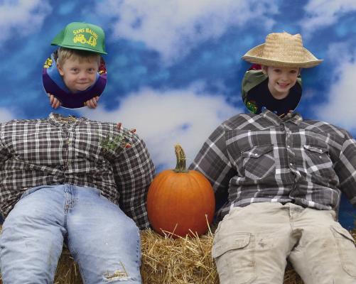 DAXTON FRY (left) and Brantlee Lane pretend to be scarecrows. ELIZABETH BARNT | Staff