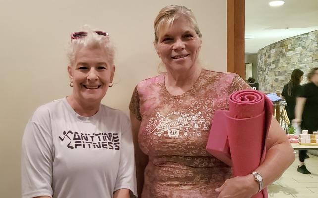 BRENDA SPICER AND KRISTY CARROLL enjoy The Elms’ Spa After Dark event, where donations of school supplies get you free spa services.