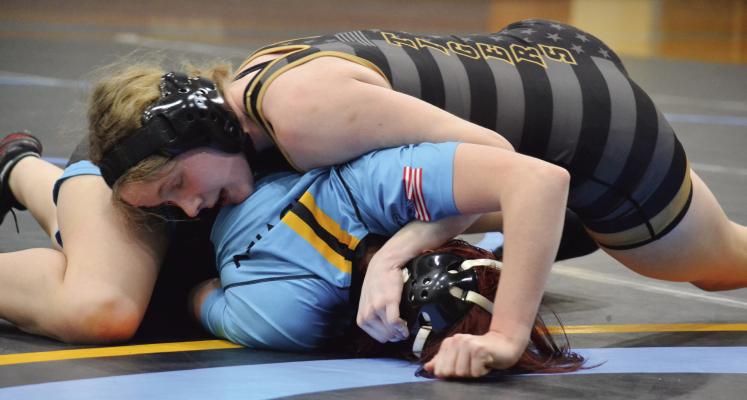 EXCELSIOR SPRINGS JUNIOR Jaylenn Hudlemeyer secures a half nelson to put her opponent on her back for a win by pin Jan. 18 at Grandview. DUSTIN DANNER | Staff
