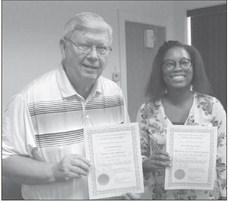 JOHN MCGOVERN (left) and Domonique Purnell show off their member credentials. ELIZABETH BARNT | Staff