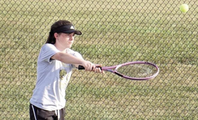 EXCELSIOR SPRINGS sophomore Shelby Stodden uses a two-hand backhand shot last week during a home win. DUSTIN DANNER | Staff