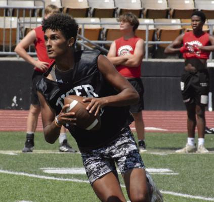 EXCELSIOR SPRINGS quarterback Marquez McCant hones his passing skills in 7-on-7 scrimmages June 20 at Tiger Stadium. The scrimmages are part of the high school football program’s offseason training. SHAWN RONEY | Staff