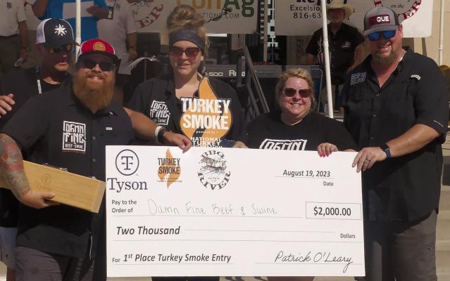 DAMN FINE BEEF AND SWINE win the turkey smoke competition and are awarded the $2,000 grand prize. ELIZABETH BARNT | Staff