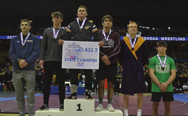 EXCELSIOR SPRINGS senior Ayden Dolt stands atop the competition Feb. 19 in Columbia after winning the Class 2 state boys wrestling title in the 152-pound division. DUSTIN DANNER | Staff