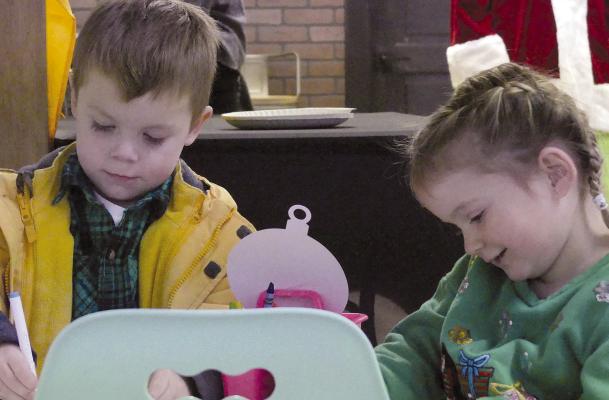 RILEY BARNT (left) and Piper Minnick make crafts together at the Excelsior Springs Small Mall event. For photos see page 6. ELIZABETH BARNT | Staff