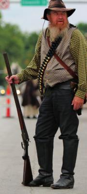 SHOTGUN in hand, Lester Williamson, Odessa, hunts outlaws. Reenactors know history, including what really happens during the Lexington bank robbery and when the military guns down Archie Clement. J.C. VENTIMIGLIA | Staff