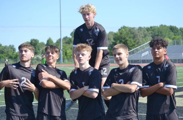 MEMBERS OF the Excelsior Springs varsity boys soccer team celebrate after scoring a goal during an Aug. 20 home preseason jamboree. DUSTIN DANNER | Staff