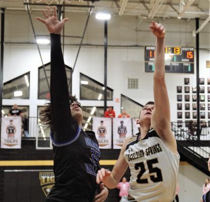 EXCELSIOR SPRINGS sophomore Easton Ryan watches his layup attempt during the first half of the Tigers’ meeting with Grain Valley. DUSTIN DANNER | Staff