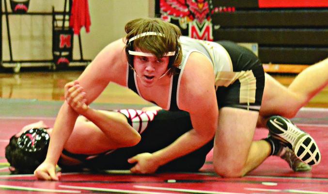 SENIOR LANE CROWLEY, shown in control of his opponent, expects to miss his friends from sports when he graduates in May 2024 from high school. DUSTIN DANNER | Staff