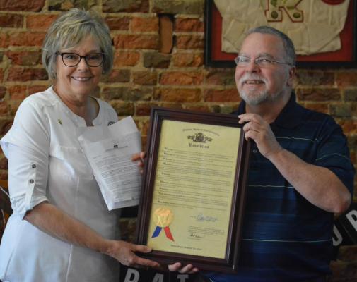 STATE REP. Peggy McGuagh presents Jack “Miles” Ventimiglia with a resolution from the Missouri House of Representatives commending Ventimiglia for his decades of service as a journalist, including with the Richmond News and Excelsior Springs Standard. A retirement party is held for Ventimiglia June 16 at Hometown Pizza in Richmond. SHAWN RONEY | Staff