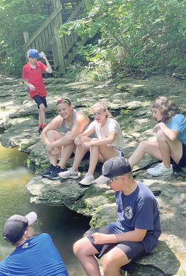 CLOCKWISE from top: middle school students Henry Lockwood, Jayden Wilkins, Kennedy Winford, Zoey Brown, Adien O’Dell, and Ozzden Ayers enjoy a trip to Watkin’s Mill as part of the Wilderness Camp enrichment program. EM RICE | Contributor