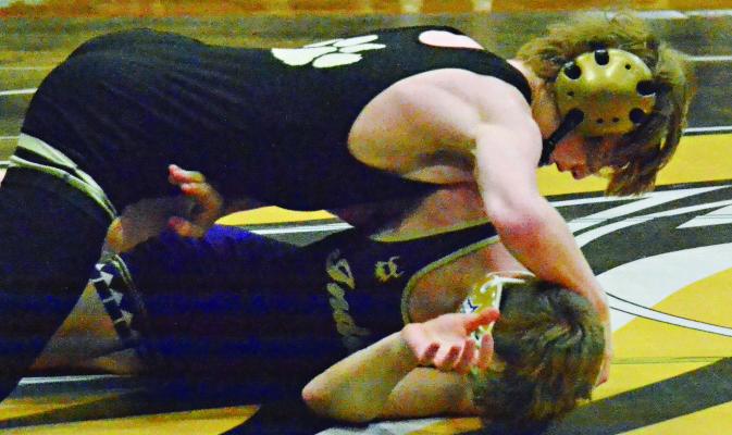 EXCELSIOR SPRINGS sophomore Cooper Collins (top) turns his Hallsville opponent for a win by pin en route to a second-place finish in his weight class Feb. 3 at the Lathrop Invitational. DUSTIN DANNER | Staff