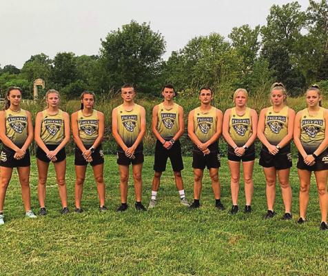 MEMBERS OF the ESHS cross country program pose together before the Forest Park Cross Country Festival Sept. 11 in St. Louis. From left are Ava Ishmael, Lacey Miller, Jacey Brewer, Silas O’Dell, Damien McCade, Macey Chaney, Kylie Albertson and Breanna Williams. EXCELSIOR SPRINGS CROSS COUNTRY PROGRAM | Submitted