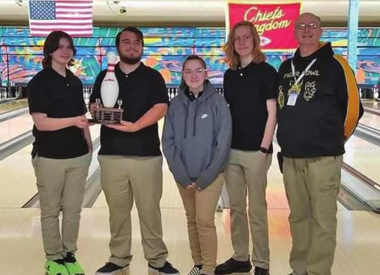 BRODY HURLA, Joshua Oldham, Olivia Smith and Colt Bowman of the Excelsior Springs I bowling team, along with coach Jerry Ferrell, display their trophy from their first tournament title this season, secured Dec. 19 at Gladstone Bowl. COURTESY OF ESHS BOWLING | Submitted
