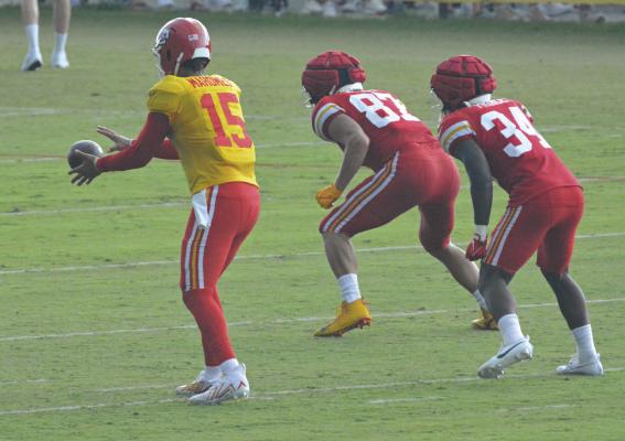 A GREAT TELEPHOTO lens can come in handy at some sports events, as this recent photo of the Kansas City Chiefs in training camp at St. Joseph shows. Pictured are Patrick Mahomes II (No. 15), Travis Kelce (No. 87) and Deneric Prince. SHAWN RONEY | Staff