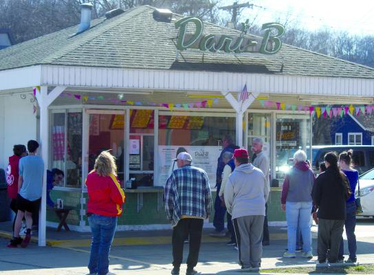 COMMUNITY MEMBERS patiently wait for their sweet treats on opening day. MIRANDA JAMISON | Staff