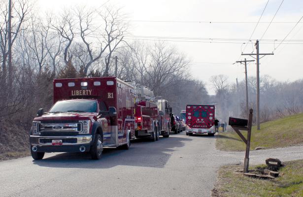 MIRANDA JAMISON | Staff SMOKE FILLS THE AIR as multiple agencies line the streets in front of Monday’s house fire in the 25000 block of Northeast 136th Street. Mutual aid departments respond to help fight the blaze and provide medical assistance. See full story on page 12.