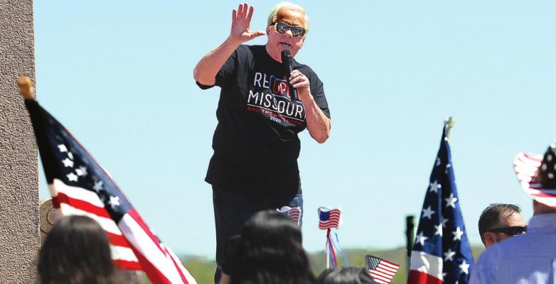 RADIO SHOW HOST Dave “Super Dave” Day warms up the Reopen Missouri crowd of about 500 on the Capitol grounds in Jefferson City last week. Several crowd members carry signs that denounce Gov. Mike Parson for issuing a stay-home order. Parson orders most of Missouri to reopen Monday. J.C. VENTIMIGLIA | Staff